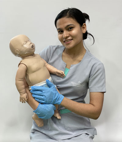 nurse on first aid training with baby